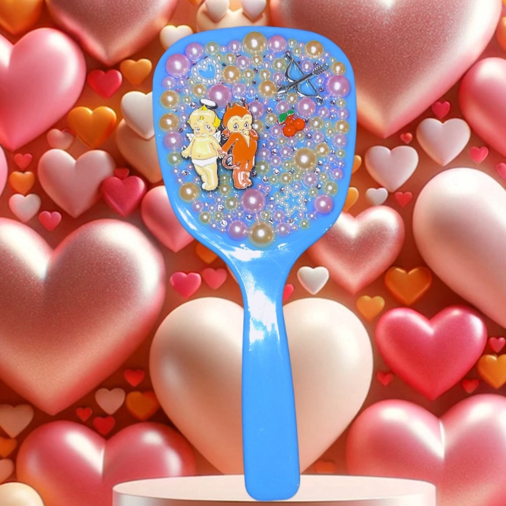 Kewpie hand mirror